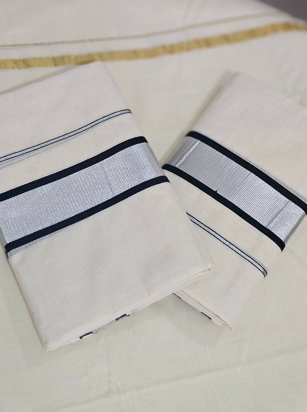 Silver kasavu with black borders set mundu  - KM 409